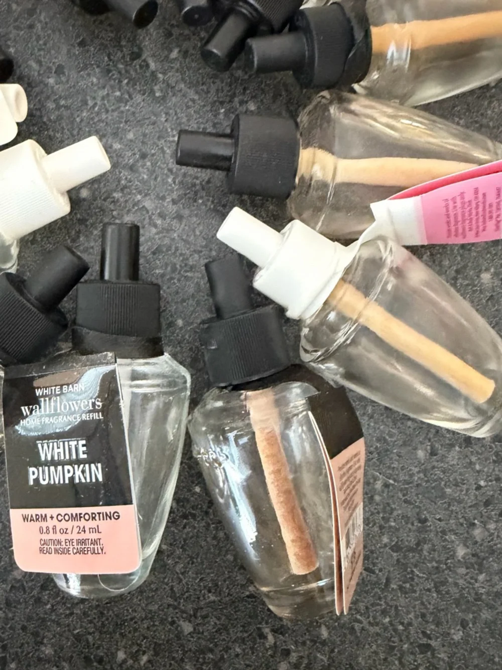 12 Empty wallflower refill bottles